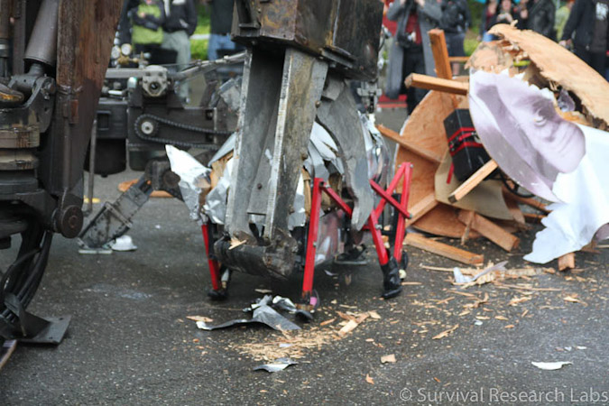 Big Arm vs Stick Wheel Robot