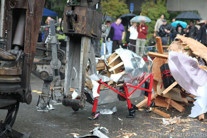 Big Arm vs Stick Wheel Robot