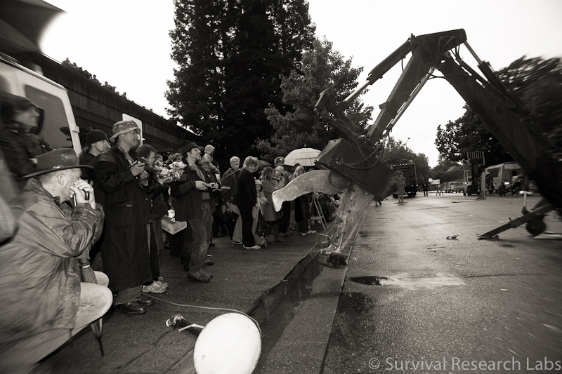 Big Arm menaces the audience