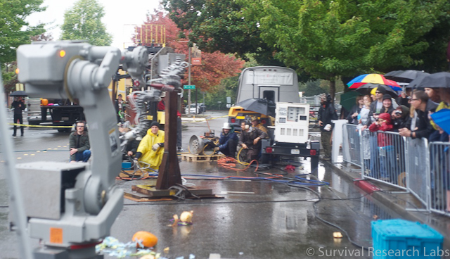Crew operating the Trihorn, Spine Robot with Motoman running in the foreground