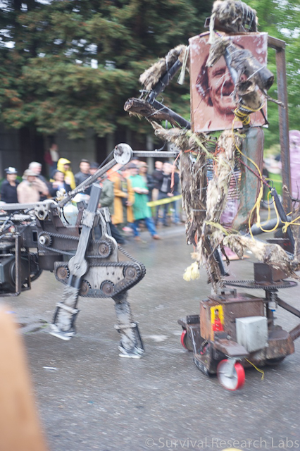 Running Machine attacks the Coyote Ugly Man on the Dual Mules